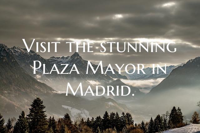 Visit the stunning Plaza Mayor in Madrid.